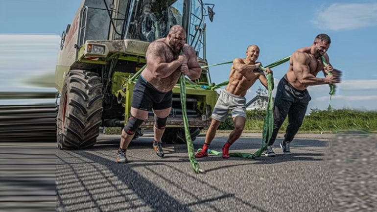 Social Room: Ex-World champ Frank Staebler boasts superhuman strength, pulls 12 ton combine harvester
