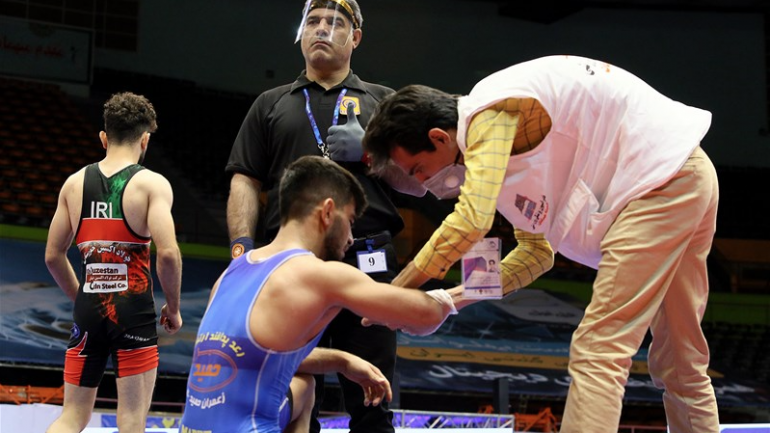 Iran Freestyle League begins, wrestlers and referees seen wearing face shields for precaution